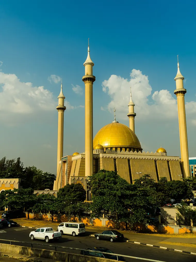 The gold dome and four minarets of the Abuja National Mosque